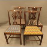Four Hepplewhite style mahogany dining chairs.