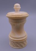 A Victorian turned ivory pepper mill (in working order). 10 cm high.