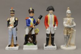 Four ceramic soldiers. The largest 22 cm high.