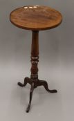 A mahogany tripod table.