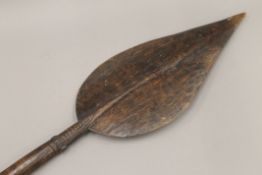 A 19th century tribal wooden paddle/spear. 130 cm long.