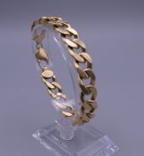 An 18 ct gold link bracelet. 20 cm long. 55.3 grammes.