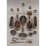 A quantity of silver and tortoiseshell dressing table items.