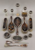 A quantity of silver and tortoiseshell dressing table items.