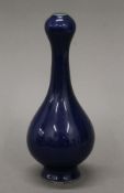 A small Chinese porcelain blue ground onion shaped vase. 17 cm high.