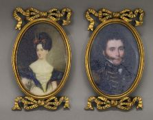 A pair of gilt framed miniature prints. Each 23 cm high.