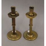 A pair of Arts & Crafts brass candlesticks. 21.5 cm high.