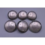 A set of six Chinese silver buttons. 3.5 cm diameter.