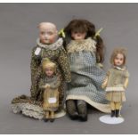Four vintage porcelain headed dolls. The largest 47 cm tall.