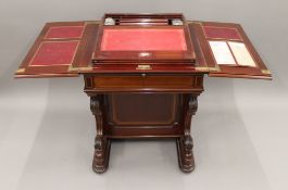 A Victorian rising folding topped line inlaid and crossbanded mahogany Davenport type desk,