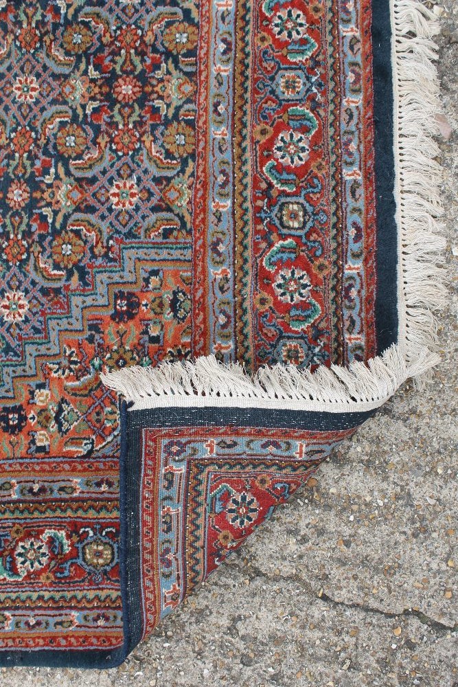 An Indian hand knotted wool rug. 233 x 169 cm. - Image 3 of 3