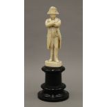 A 19th century Dieppe carved ivory model of Napoleon Bonaparte mounted on an ebonised wooden plinth