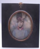 An 18th century framed portrait miniature of a soldier. Frame 12 cm x 14 cm.