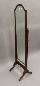 A 20th century mahogany cheval mirror. 157 cm high.