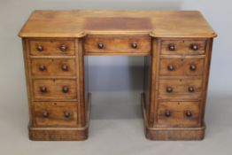 A Victorian mahogany pedestal breakfront dressing table. 121 cm wide.