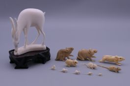 Eleven late 19th/early 20th century ivory figures of rats and an ivory figure of a deer on stand.