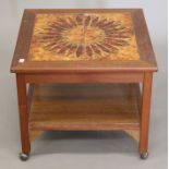 A 20th century tiled top coffee table. 52 cm wide.
