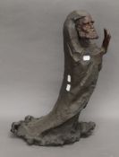 An abstract bronze model of an Oriental deity. 52 cm high.