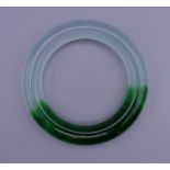 A two tone jade bangle. 6.26 cm inner diameter.