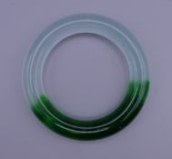 A two tone jade bangle. 6.26 cm inner diameter.