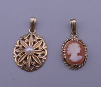A pair of gold pendants. Cameo pendant 1.5 cm high, other 1.75 cm high.