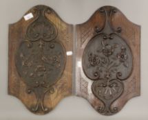 A pair of Victorian carved panels. Each 49.5 cm high.