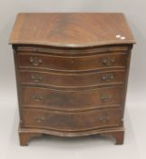 A 20th century Serpentine chest of drawers. 70.5 cm wide.