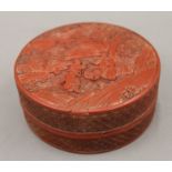 A 19th century Chinese carved cinnabar lacquer circular box. 13 cm diameter.