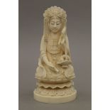 A late 19th century Chinese carved ivory model of Buddha, the underside with seal mark. 15.