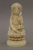 A late 19th century Chinese carved ivory model of Buddha, the underside with seal mark. 15.