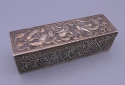 A Chinese silver box. 13 cm wide x 3.75 cm high x 4 cm deep. 152.4 grammes.