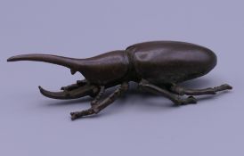 A bronze model of a beetle. 8 cm long.