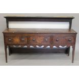 An 18th century oak dresser. 175 cm wide.