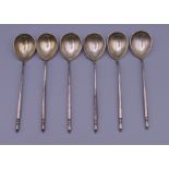 A set of six Russian silver niello teaspoons. Each 13 cm long.