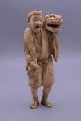 A 19th century Japanese ivory okimono. 14 cm high.