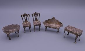 Five pieces of miniature Dutch silver furniture. Chairs 5.5 cm high.