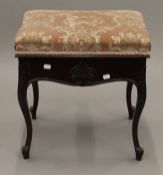 An Edwardian mahogany piano stool. 48 cm wide.