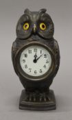 An owl form clock. 16 cm high.
