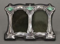 An Art Nouveau style silver double photograph frame. 11 cm wide.