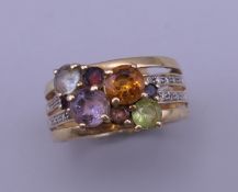 A 9 ct gold multi-stone and diamond ring. Ring size N/O.