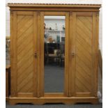 An Arts and Crafts inlaid ash triple wardrobe, en-suite (see also the following two lots).