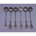 Six Chinese silver coin spoons. 17 cm long.