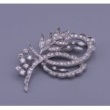 An 18 ct gold diamond spray brooch. 5 cm wide. 16.5 grammes total weight.