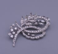 An 18 ct gold diamond spray brooch. 5 cm wide. 16.5 grammes total weight.