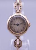 A 9 ct gold ladies wristwatch. 20.7 grammes total weight.