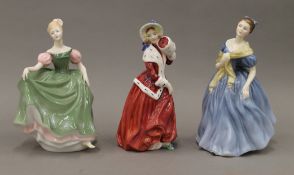 Three Royal Doulton figures; Adrienne, Christmas Morn and Michele.