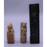 Three soapstone seals. Largest 11.5 cm high, two 6.5 cm high.