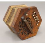 A Victorian rosewood concertina. 19 cm wide.