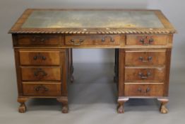 An early 20th century walnut pedestal desk. 136 cm wide x 75.5 cm deep.