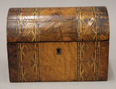 A Victorian inlaid walnut dome topped tea caddy. 20 cm wide.